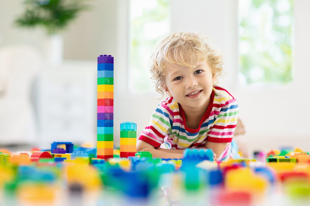 Child playing with toy blocks at a Preschool & Daycare Serving San Antonio, TX