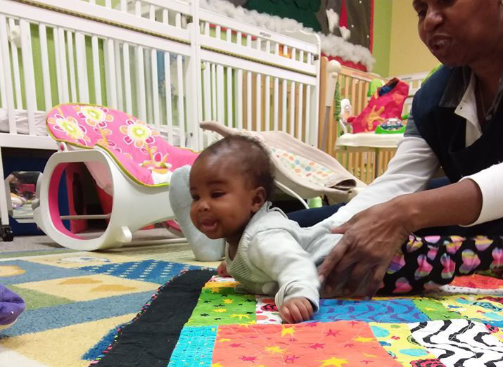african american baby crawling at a Preschool & Daycare Serving San Antonio, TX