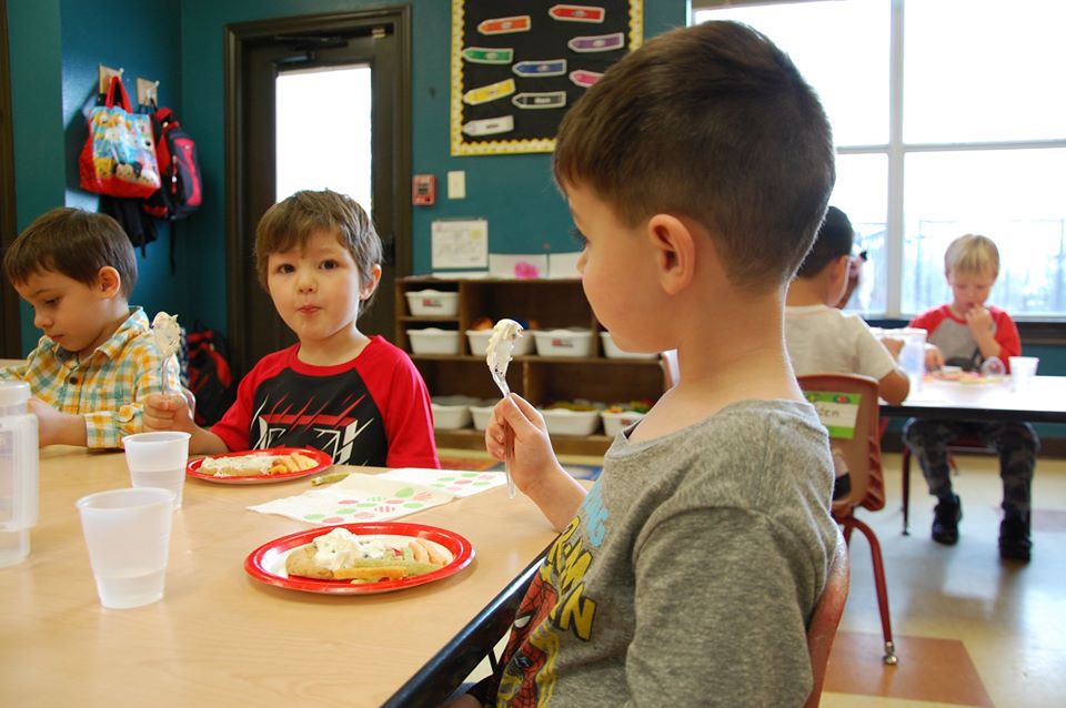 happy boys eating at a Preschool & Daycare Serving San Antonio, TX