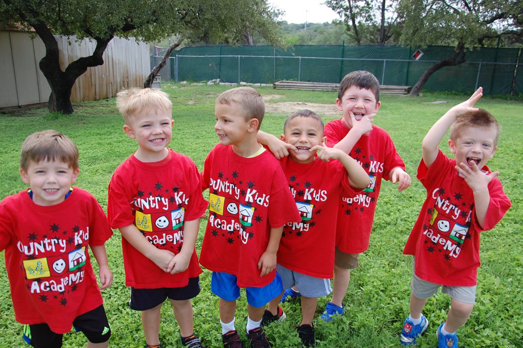 happy boys smiling outside at a Preschool & Daycare Serving San Antonio, TX