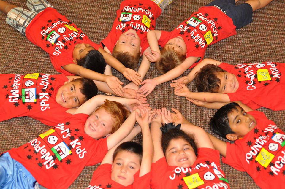 happy children lying on carpet at a Preschool & Daycare Serving San Antonio, TX