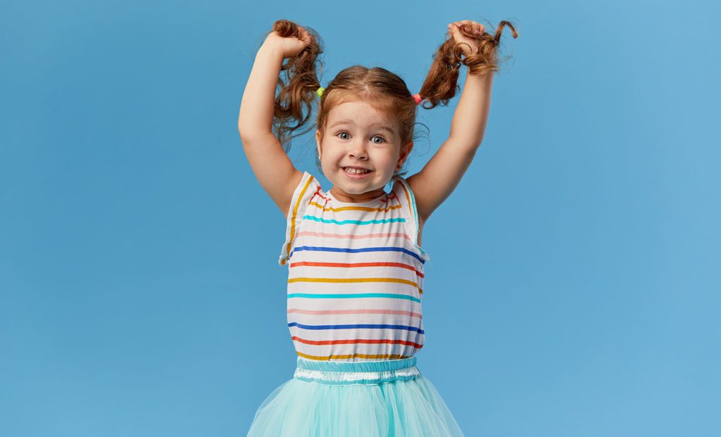 smiling cute little toddler girl at a Preschool & Daycare Serving San Antonio, TX