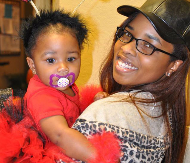 smiling mom holding baby at a Preschool & Daycare Serving San Antonio, TX