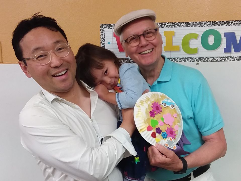 smiling toddler with dad at a Preschool & Daycare Serving San Antonio, TX