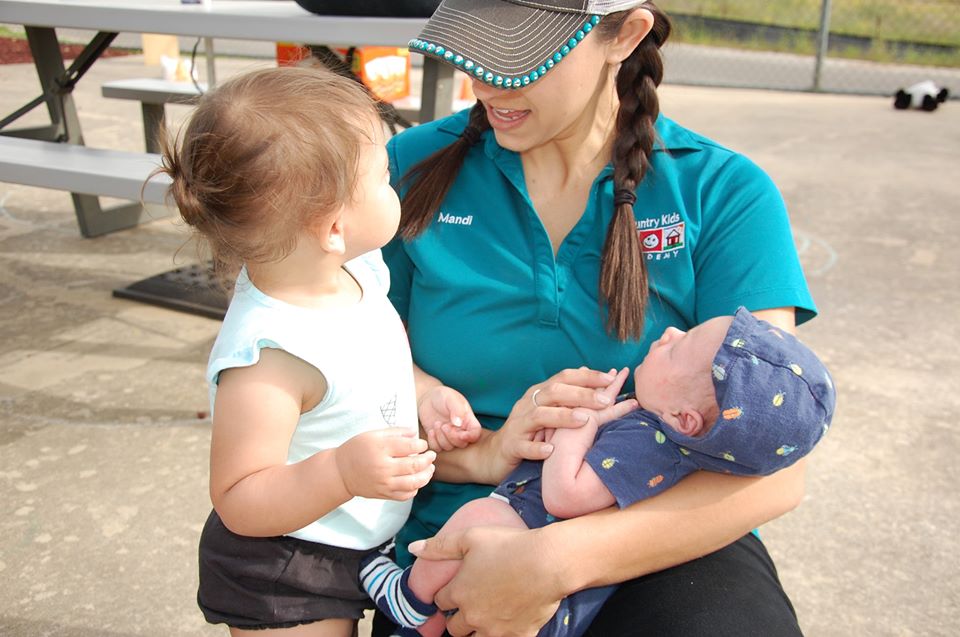 teacher and toddler at a Preschool & Daycare Serving San Antonio, TX