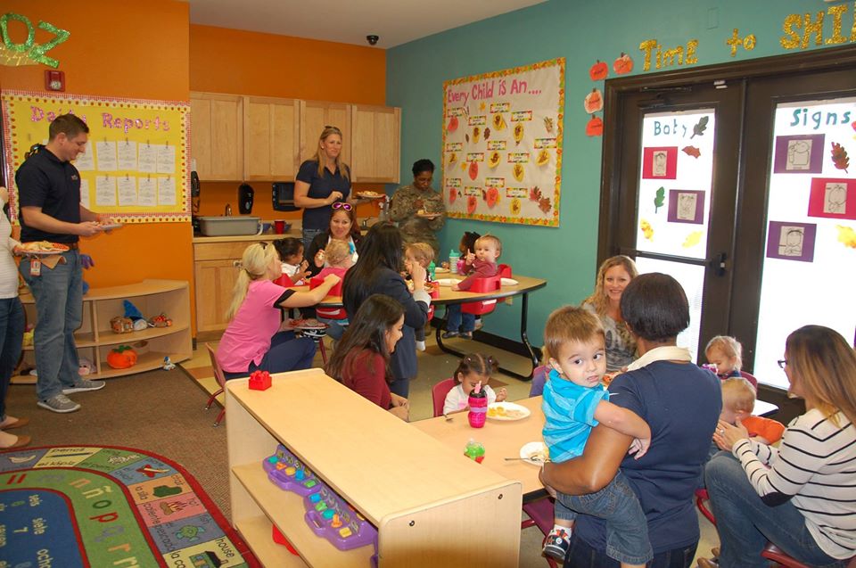 teachers with happy babies in a classroom at a Preschool & Daycare Serving San Antonio, TX