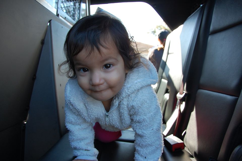 toddler in back of vehicle at a Preschool & Daycare Serving San Antonio, TX